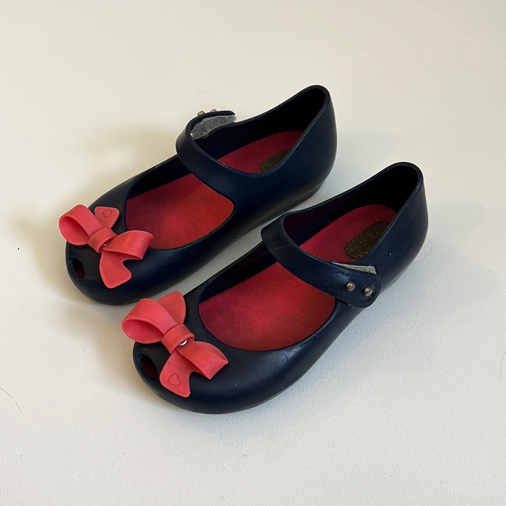 Mini Melissa Sz 10 toddler navy with pink bow shoe.